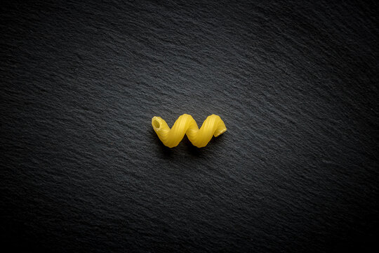 celentani pasta on dark slate. isolate