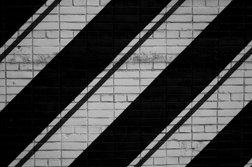 white brick wall pavement with black stripes