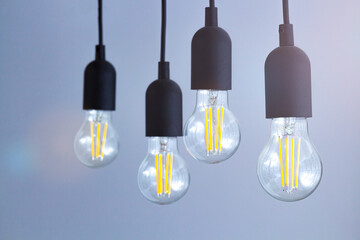 A set of light bulbs located on the wires