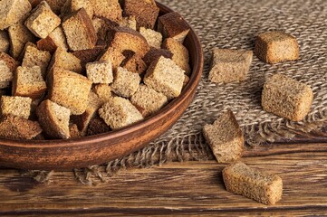 small croutons in a bowl on a wooden table