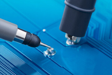 Measuring electronic signal using oscilloscope on the PCB. Electronics repair and digital...