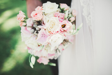 Beautiful wedding bouquet with different flowers, roses