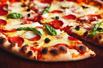 a large sliced pizza lies on a wooden table