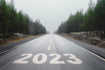 Highway with the inscription 2023. New Year 2023. A murky future. High quality photo