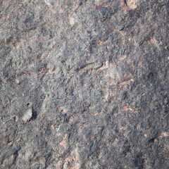 Natural rough grey granite rock surface texture closeup