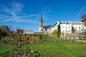 Beautiful park in Herrngarten, Darmstadt, Germany with a beautiful church in the background.