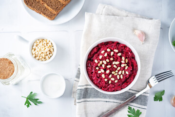 Beetroot salad with pine nuts in a bowl