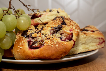 Fresh sweet buns with plums.