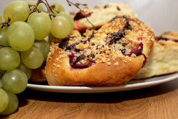 Fresh sweet buns with plums.