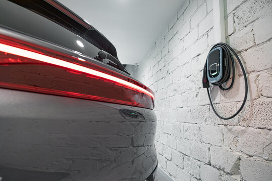 Charging station of a modern electric car. The back of the electric crossover.