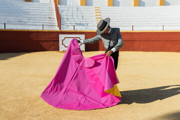 Spanish bullfighter with traditional cowboy suit and hat