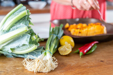 A close up of vegetables being prepared for lunch, with a shallow depth of field