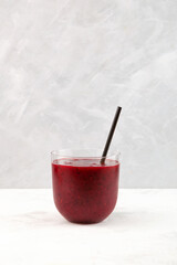Cranberries and black currant smoothie in glass. Healthy fruit berries cocktail, antioxidant slush drink