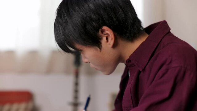 Asian student studying English at home. Exam, Test, Knowledge.