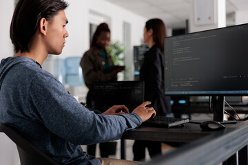 Engineers programming server code algorithm on computer, typing sever data in it agency office. Database programer working on new user interface with online system to create algorithm.