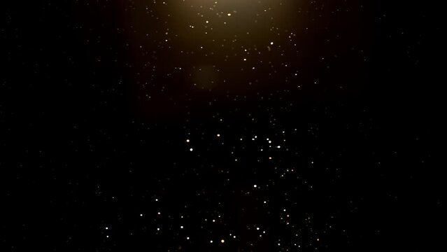 Super slow motion of abstract gold particles on black background. Filmed on high speed cinematic camera at 1000 frames per second.
