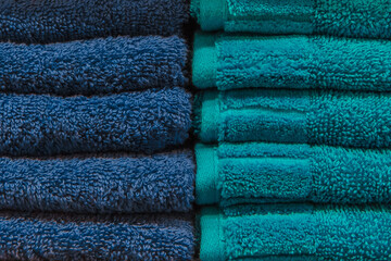 Set pile stacked blue color fabric towels object hygiene bathroom concept, close up