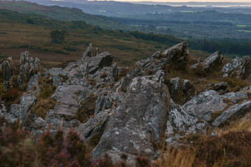 Rocky landscape at Roc'h Trevezel summit on a autumn evening during golden hour at sunset, Parc naturel regional d'Armorique, Brittany, France