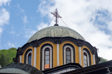 Dome and metal cross atop the main church at the Monastery of Saint John of Rila, also known as...