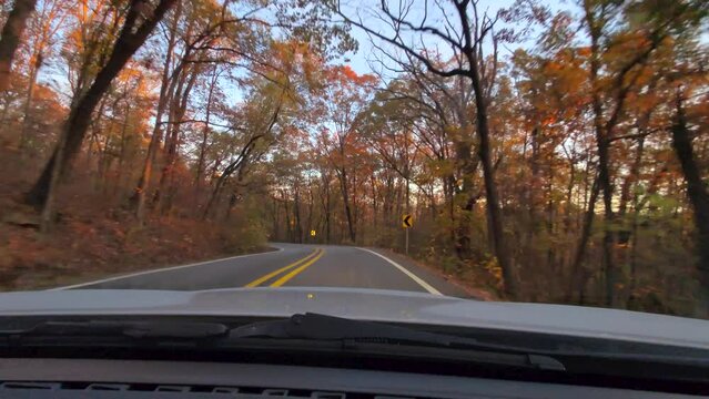Driving on The Road During Beautiful Peak Autumn Fall Foliage Vibrant Colors Trees Leaves Arkansas Scenic Countryside