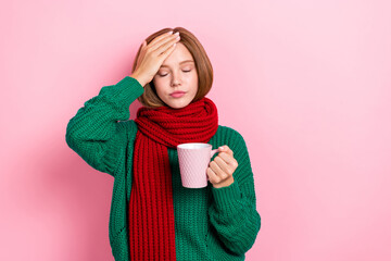 Photo of unhappy upset young lady wear green sweater red scarf feeling bad drinking hot medicine...