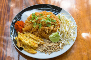 Fried noodle Thai style in a plate on the table