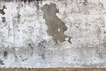 Old cement wall background, peeling and dirty paint