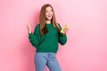 Photo of youngster excited crazy girl wear green knitted pullover fist up positive winner betting...