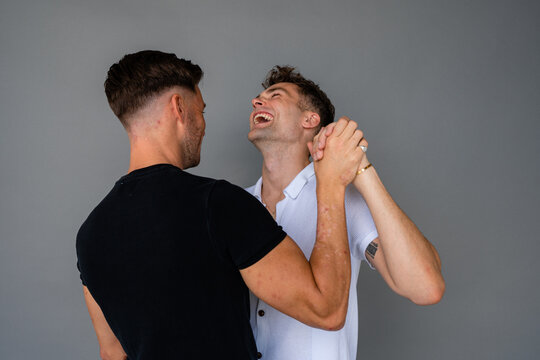 beautiful gay couple dancing and laughing