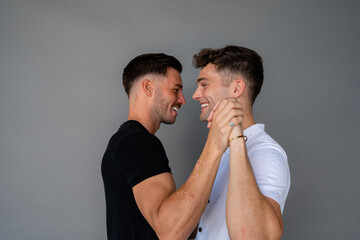beautiful gay couple dancing and smiling - obrazy, fototapety, plakaty