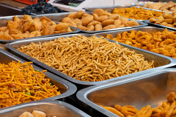 Bhujia, a spicy deep-fried sev filled with a burst of flavors, made using gram flour, moth flour, and different spices, crispy & crunchy traditional namkeen being sold in Jodhpur, Rajasthan, India.