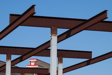 A rusty metal structure on a blue sky