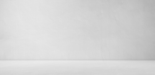 Backdrop empty gray light bright  smooth cement wall room background.blank table studio interiors...