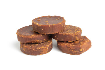 cylindrical dark brown sugar or palm sugar isolated on white background