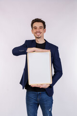 Portrait of happy businessman showing blank signboard on isolated white background