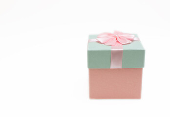 Pink and blue gift box with bow on white background with copy space happy festival images