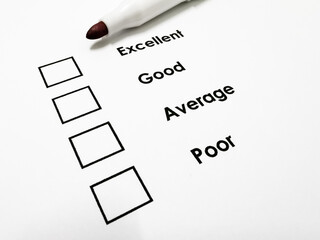 Survey form with black checkbox and a pen.