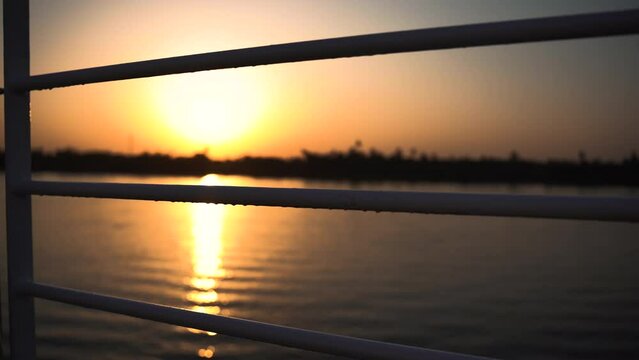 sunset overt Nilo river in Egypt, sail boat cruise the water of the ancient river 