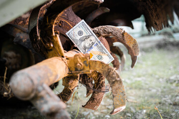 Stopped rural industry due to financial problems. A hundred dollar bill close-up on the teeth of a...