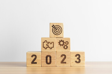 2023 wood block with business goal, plan. Action strategy, target, mission, teamwork, idea and New...