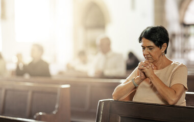 Senior woman praying in church, worship and trust God, prayer or spiritual respect. Christian woman...