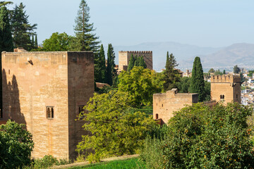 Fototapeta na wymiar Fortification and towers of the ancient Alhambra in Grenada, Spain