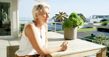 Senior woman, coffee and thinking in the neighborhood relaxing by the balcony table at home in the outdoors. Elderly female having a morning drink in thought for start, routine or vision outside