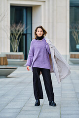 Young woman posing on the street
