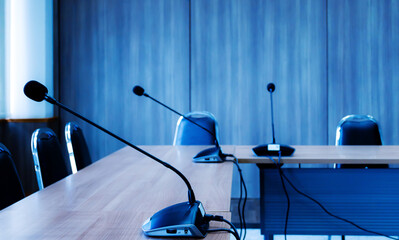 Microphone row on table in meeting room
