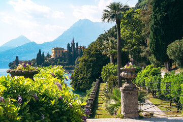 Stunning panoramic view of the historic luxury Villa Monastero with gorgeous lakefront gardens and spectacular Lake Como views in Varenna, Province of Lecco, Italy.