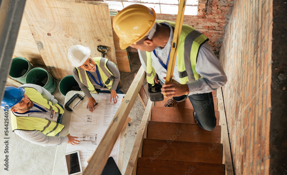 Poster Top view, construction building and team planning with blueprint, collaboration and conversation. Architecture, engineer and teamwork on site brainstorming, discussion and group project with hardhat.