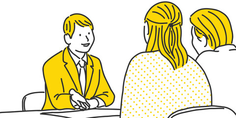 ご夫婦に説明をするビジネスマン