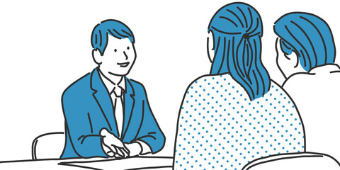 ご夫婦に説明をするビジネスマン