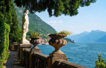 Gorgeous view of Lake Como visible from the walking path along Villa Monastero with beautiful lakefront garden in Varenna, Province of Lecco, Italy.